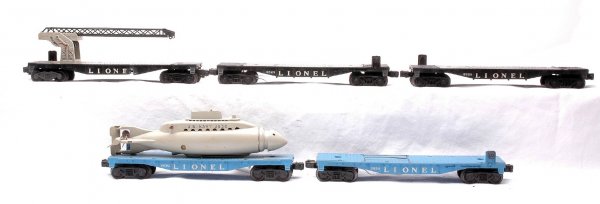 Lionel 2-6830 Sub Cars 6512 Picker two 6828 Flats: Lionel postwar freight cars; two 3830 operating submarine cars, one missing the sub, 6512 cherry picker car and two 6828 flatcars only. Please view photos to verify selection and condition. This lot w