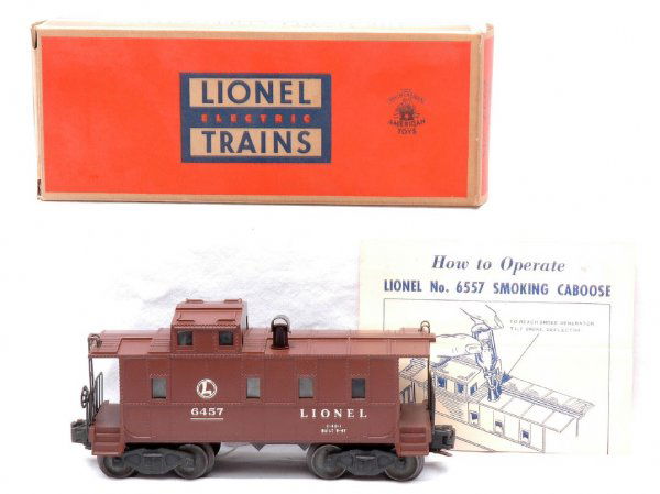 Lionel 6557 Illuminated Smoke Caboose LN OB: Lionel postwar 6557 illuminated smoke caboose in OB with instruction sheet. Except for one small chip next to the smoke stack, caboose is C8. OB is square with all flaps attached, C9.
