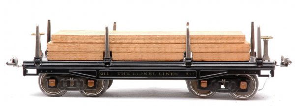 Lionel 211 Black Flatcar with Lumber Load: Lionel prewar standard gauge 211 black flatcar with lumber load, nickel stakes and copper journals. Flatcar has small spots of corrosion on bases holding stakes on one side of car only, otherwise car