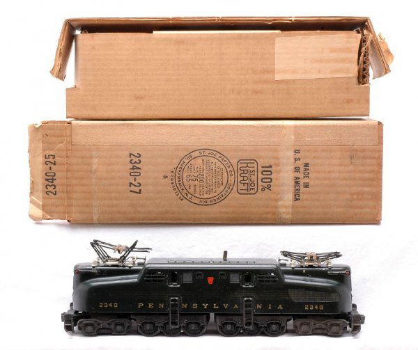 Lionel 2340 Green Pennsylvania GG1 w/Five Stripes: Lionel postwar 2340 green Pennsylvania GG-1 diesel with five stripes in OB with original cardboard insert. The gold heat stamped lettering is strong. The striping is faded in some areas and one top co