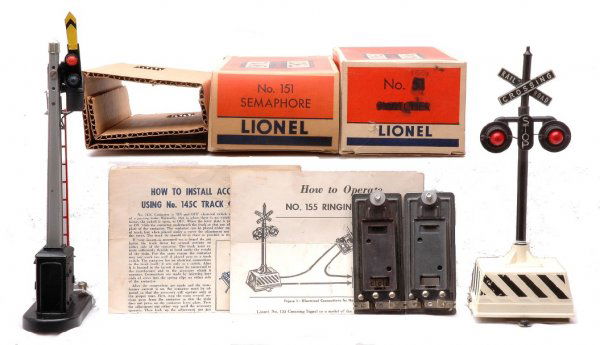 Lionel 151 Semaphore 155 Highway Signal Boxed: Lionel postwar 151 semaphore in OB with a 145C contactor, original cardboard insert and instruction sheet. The OB for the 151 has all flaps attached except for one end flap which is detached but prese