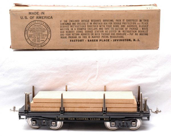 Lionel 211 Flatcar with Lumber Load LIKE NEW OB: Lionel prewar standard gauge 211 flatcar with lumber load in OB. The flat car has nickel trim, stakes and journals. The car is C8. The OB is a brick, is sealed on the bottom and has strong printing.