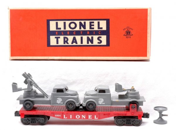 Lionel 6804 Flatcar w/two USMC Trucks LN OB: Lionel postwar 6804 flatcar with two USMC trucks in OB. One of the trucks has a broken loud speaker, otherwise other truck and flatcar are C8. OB has all flaps detached on one end but included. The ot