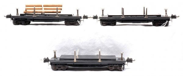 Lionel Three 3811 Operating Log Cars: Lionel prewar O gauge three 3811 operating lumber cars, one with five wooden logs. The cars are C7.
