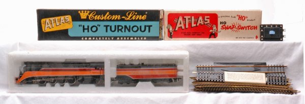 Lionel HO SP Loco 4455 and Tender Atlas Track: Lionel HO scale Southern Pacific daylight steam loco and tender. Loco is numbered 4455. Loco and tender have never been run, C9-20. Also included is Atlas HO629 uncoupler track, turnout in OB, remote 