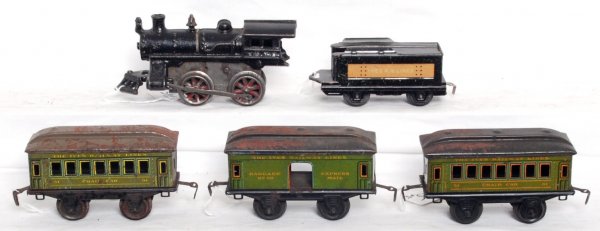 Ives No. 6 loco and tender, 50, 51, 51: Ives prewar O gauge cast iron key wind No. 6 loco and tender with 50 baggage, 51 chair car, 51 chair car.