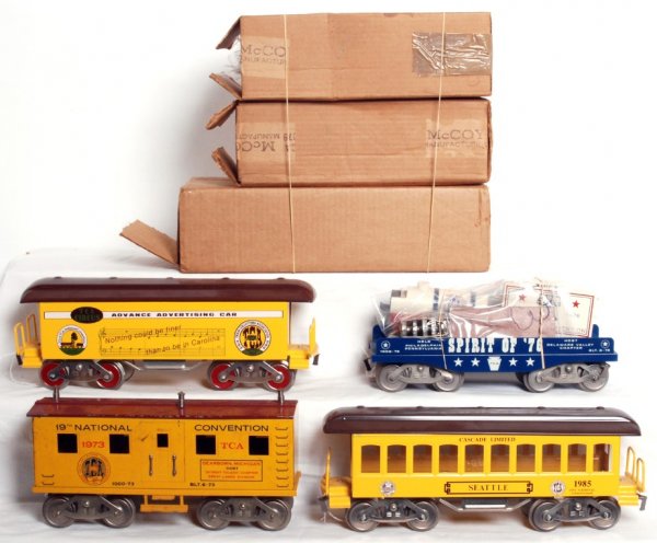 Four McCoy wide gauge TCA cars and loads