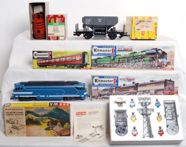 Mixed lot of European style trains: Nice mixed lot of European style trains, some in factory sealed original boxes, C7-10. AHM Eheim 4021 HO aerial cable car system. LGB 4041 O.E.G. ore dump car. AHM Brawa Nr. 290 DM Bausatz HO aerial c