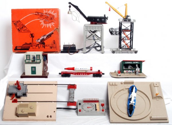 Lionel 443, 175, 6175, 128, 445, 282: Lionel 443 missile launching platform with exploding ammunition dump in OB, 175 rocket launcher, 6175 flatcar with rocket, 128 animated newsstand, 445 operating switch tower and 282 gantry crane with 