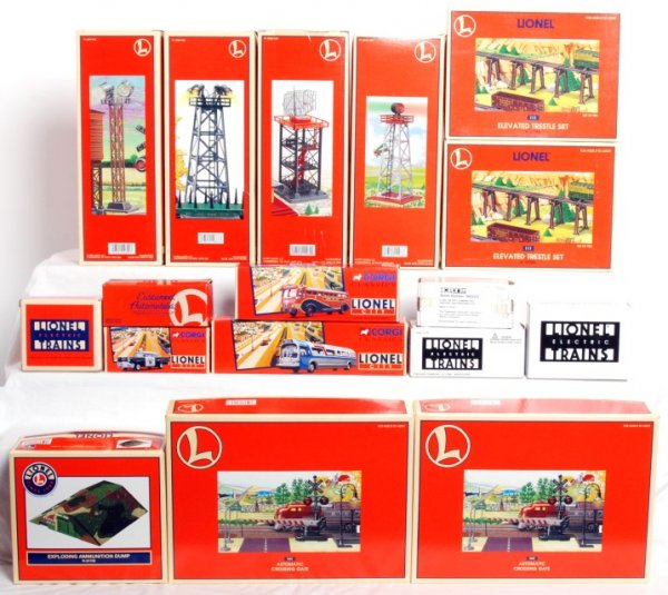 Large lot of Lionel accessories in OB: Large lot of Lionel accessories in original boxes and some diecast vehicles in original boxes, C8-10. 24106 exploding ammunition dump, two 12755 No. 111 elevated trestle sets, two 62162 No. 262 automa