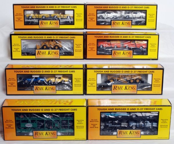 Sixteen MTH Rail King freight cars in OB: Sixteen MTH Rail King freight cars in original boxes, C8-10. Boxes show little to very light wear, few price stickers. 30-7682 NYC flat w/Mercurys, 30-7676 flat w/Chrysler and Mercury, 30-7624 flat w/