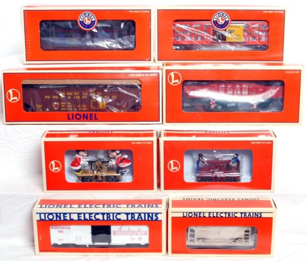Fifteen various Lionel trains in original boxes: Lionel 1998 LCCA Amtrak Express/baggage boxcar, 19961 1992 Gadsen Pacific Museum, 26737 Mr. & Mrs. Claus animated gondola, 36712 Ballyhoo Bros. elephant, 26747 Halloween aquarium, 18467 train robbery
