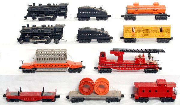 Lionel 1060 and 1061 locos w/tenders and 7 cars: Lionel postwar 1060 and 1061 steam locos with slopeback tenders and seven freight cars, 6519 Allis Chalmers car w/one good and one cracked brake wheel, 3512 ladder car missing one prong on the side fo