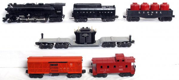 Lionel 2055 loco, 6112, 3656, 6518, 6257: Lionel postwar 2055 steam loco with a whistle tender, 6112 gondola with four red canisters, 3656 Armour stock car, 6518 transformer car and 6257 SP type caboose, nicer C6 area.