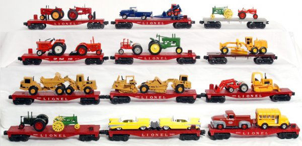 Nineteen Lionel flatcars with diecast loads: Nineteen Lionel flatcars with diecast loads, all but one are postwar. Flatcars look C5-7. Vehicles look C6-8. 3460, 6825, 6805, 6801, 6803 missing one step, 6801, 6405, 6818, 6801, 6821, 6818, 6816, 6
