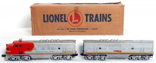 Lionel No. 2353 Santa Fe F3 diesel A-B in MC: Postwar O gauge Lionel No. 2353 Santa Fe F3 diesel A-B units in master carton, C6. Locos have original porthole lens and powered unit has a clean battery compartment. 2353T OB has tape repaired flaps,