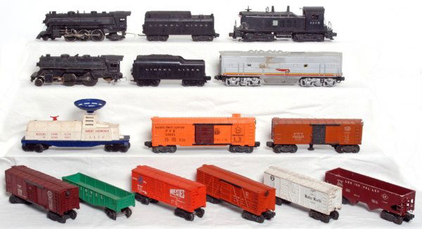 Lot of Lionel postwar O gauge trains: Lot of Lionel postwar O gauge trains, 1666 steam loco, 1120 steam loco, two unnumbered tenders, 6220 Santa Fe NW2 diesel switcher, unnumbered Santa Fe F3 diesel B unit, 3470 aerial target launcher, 33