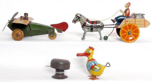 Windup tin toys, Ferdinand Strauss Mail plane: Group of windup tin toys. Ferdinand Strauss Corp. Mail plane 43, approximately 8 inches long, 6-3/4 inches wide and 3-1/2 inches tall. Hee Haw cart measures approximately 10-1/2 inches long, 3-1/4 inc