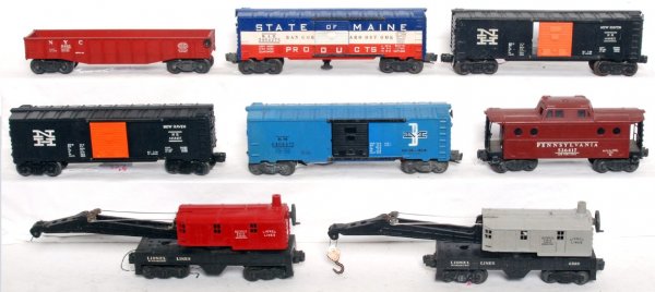 Lionel 6560, 3494-275, 6464-425, -475, 6462, more: Lionel postwar O gauge freight cars. 6560 operating work crane, unnumbered operating crane, 3494-275 State of Maine operating boxcar rusty door guide, 6464-425 New Haven boxcar missing a door and door