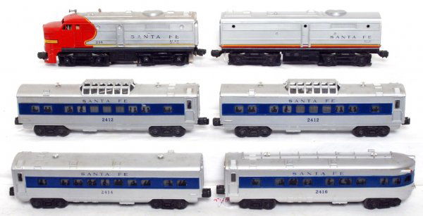 Postwar Lionel 218 Santa Fe Alcos with passengers: Postwar O gauge Lionel 218 Santa Fe Alco diesel A-B units with Santa Fe blue stripe passenger cars, two 2412 vista domes, 2414 Pullman coach and 2416 observation, small chip in roof detailing. Trains