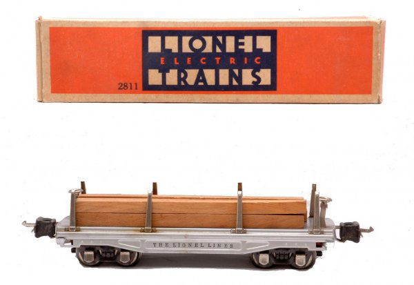 Lionel 2811 Aluminum Flatcar w/Lumber Load OB: Lionel prewar O gauge 2811 aluminum flatcar with lumber load, nickel stakes, brake wheels and journals in OB. The flatcar is C7. The OB has all flaps attached with some tape repair.