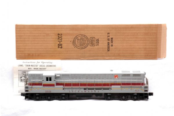 Lionel 2321 Lackawanna FM Gray Roof LN Boxed: Lionel postwar 2321 Lackawanna FM Train Master diesel with gray roof in OB. Both ends of the diesel have hair line screw hole cracks, otherwise, C8. The OB has all flaps attached, but is split along o