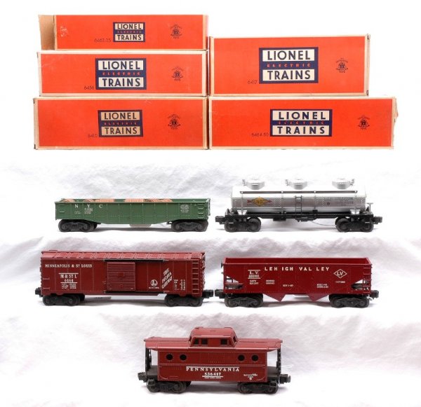 Lionel 6415 6456 6462-25 6464-50 6417 Boxed: Lionel postwar five freight cars; 6415 silver Sunoco three dome tank, 6456 maroon Lehigh Valley hopper, 6462-25 NYC green gondola with six wooden barrels, 6464-50 Minneapolis & St. Louis type I boxcar