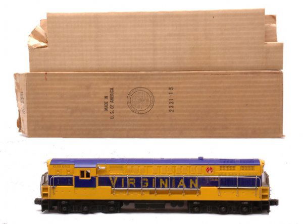 Lionel 2331 Virginian FM Train Master LN OB: Lionel postwar 2331 Virginian FM Train Master diesel in OB with original cardboard insert. Both ends of the cab have screw hole cracks. There is one small hand rail missing on the side of cab. The die