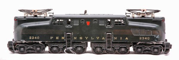 Lionel 2340 Dark Green Pennsy Five Stripe GG-1: Lionel postwar 2340 dark green Pennsylvania GG-1 with five gold stripes. The stripes are faded in the middle of cab and on ends. The lettering is strong and all decals are intact, C6.