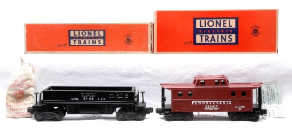 Lionel 3469X Dump LN OB 6417 Pennsy Caboose MIB: Lionel postwar 3469X automatic dump car with a 207 bag of coal in OB and 6417 Pennsylvania caboose with inspection tag in OB. The 3469X dump car is a C8. The 6417 caboose has never been run, C9-10. Th