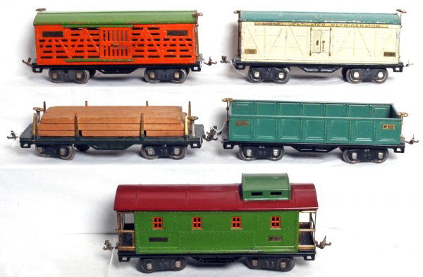 Lionel prewar S.G. 511, 512, 513, 514R, 517: Lionel prewar standard gauge 511 flatcar with lumber load, 512 gondola, 513 stock car, 514R reefer and 517 caboose, C6 area.