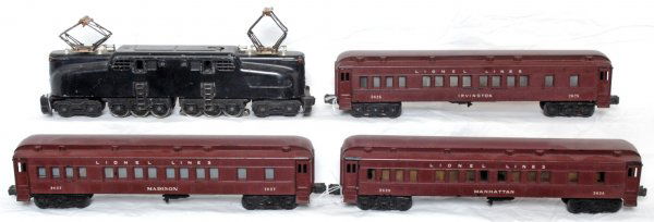 Black Lionel 2332 GG-1, 2625, 2627, 2628: Postwar O gauge Lionel 2332 Pennsylvania GG-1 electric 5 stripe black locomotive with three passenger cars, 2625 Irvington coach, 2627 Madison coach and 2628 Manhattan coach. Loco is missing a screw a