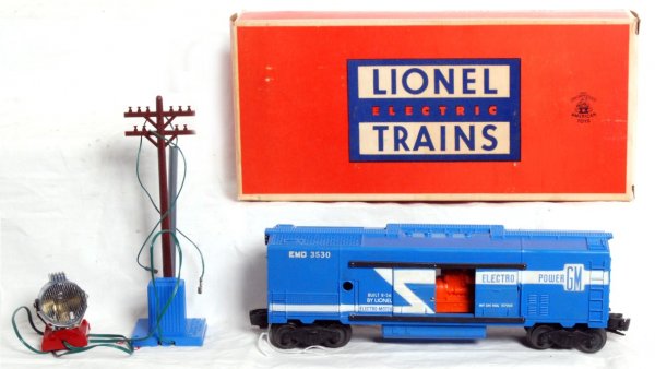 Lionel postwar O gauge 3530 GM generator car, OB: Lionel postwar O gauge 3530 GM generator car, long stripe variation with blue tanks and blue 3530-20 base. C7+. OB is C9+ with insert and yellow inst. sheet.