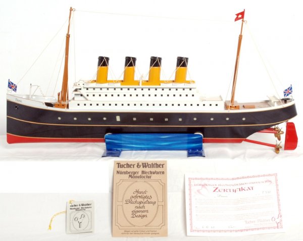 Tucher-Walther keywind powered tin Titanic 24Ó: Tucher-Walther key wind windup powered tin Titanic, approximately 24 inches long and 11-1/2 inches tall including stand. Boat has a little display dust but should clean to look C9 area. Included is th