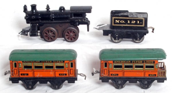 American Flyer No. 5 loco, No. 121 tender, pass.: American Flyer prewar O gauge No. 5 cast iron key wind locomotive with No. 121 tinplate and two passenger cars, a coach and an observation.