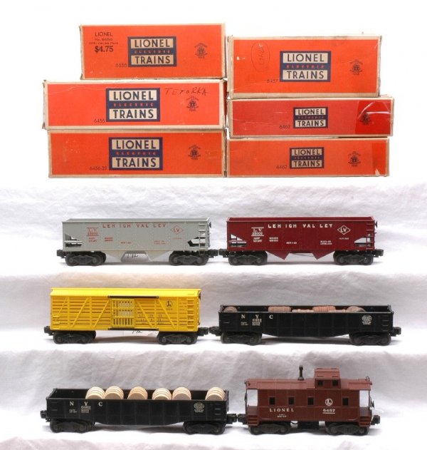 Lionel Freight 6456 6456-25 2-6462 6656 6457: Lionel postwar freight cars; 6456 maroon Lehigh Valley hopper, 6456-25 gray Lehigh Valley hopper, two 6462 NYC black gondola one with six reproduction wooden barrels and one with six wooden barrels, 6