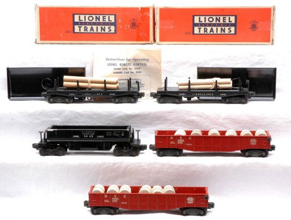 Lionel Freights 3461 3461 w/OBs 3469 6462 6462: Lionel postwar freight cars including; 3461 operating lumber car, circa 1949-51 with wood load, 160 bin and instruction sheet in OB, 3461 automatic lumber car with wood load, 3469 automatic dump car a
