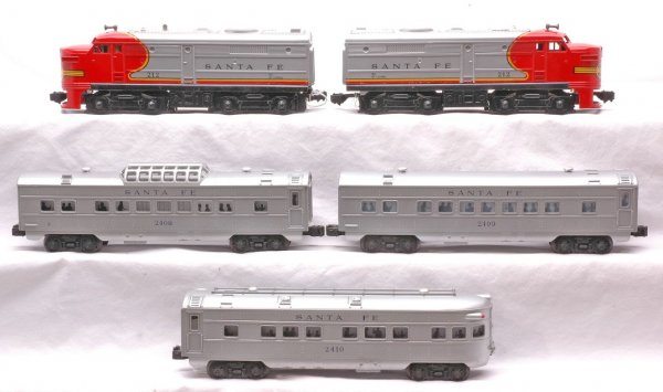 Lionel Santa Fe Pass Set 11590 212 2408 2409 2410: Lionel postwar Santa Fe passenger set no. 11590, circa 1966 containing; 212 Alco diesel AA units, 2408 vista dome, 2409 Pullman and 2410 observation. The passenger cars are silver with blue lettering.