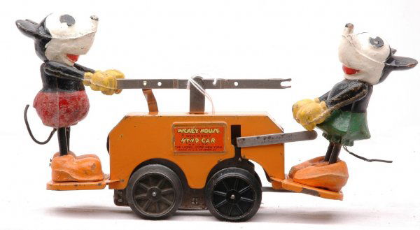 Lionel 1100 Mickey Mouse Clockwork Handcar: Lionel prewar O gauge 1100 Mickey Mouse clockwork handcar with an orange base. Minnie Mouse is missing her hat and the legs have been replaced. The handcar is C5.