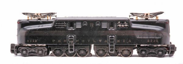Desirable 2332 Black Pennsylvania GG-1 Diesel: Desirable Lionel postwar 2332 black Pennsylvania GG-1 loco with rubber stamped keystone and gold stripes. The stripes have some fading. There is bubbling in the paint on one side. GG-1 is C6.
