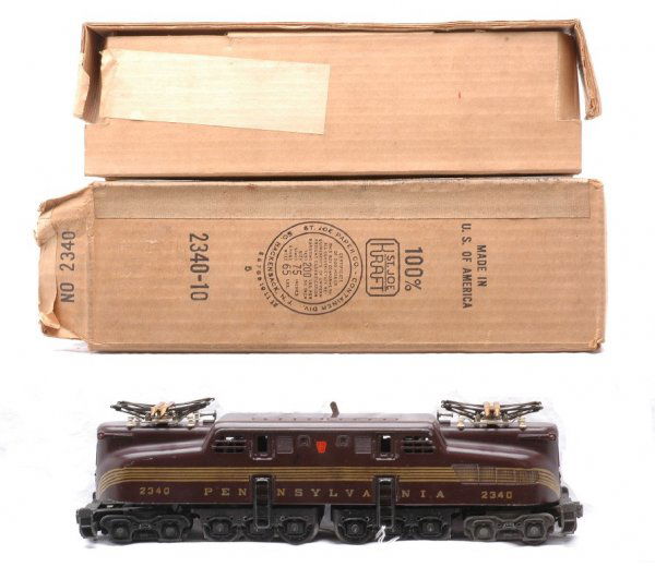 Lionel 2340 Tuscan Pennsylvania GG-I Boxed: Lionel postwar 2340 Tuscan Pennsylvania GG-1 with five stripes in OB with original cardboard insert. The GG-1 has been re-striped, otherwise C7. The OB has all flaps attached and is sealed on one end.