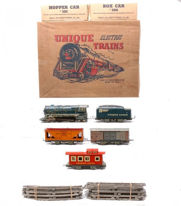 Unique Art Mfg. Co. Litho Freight Set 1951 Boxed: Unique Art Manufacturing Co. lithographed freight set no. 1951 in set box containing; steam loco numbered 1950, tender, 101 hopper in individual OB, 100 boxcar numbered 3905 in individual OB, a caboos