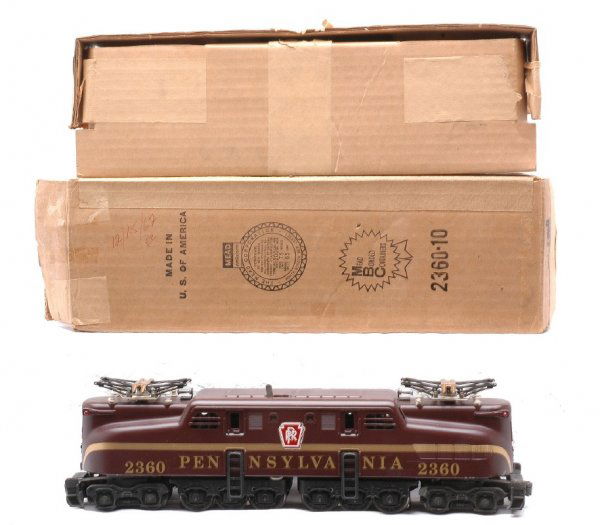 Lionel 2360 Tuscan PRR GG1 Single Stripe Decal LN: Lionel postwar 2360 Tuscan Pennsylvania GG-1 loco with a single stripe in OB with original cardboard insert. This is the version with the large decaled lettering and numbers, circa 1962-63. The stripi