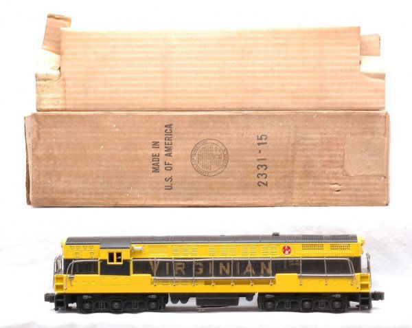 Lionel 2331 Virginian FM Train Master Boxed: Lionel postwar 2331 Virginian FM Train Master diesel, this is the black and yellow version in OB with original cardboard insert. There are screw hole cracks on both ends of the diesel, otherwise C7-8.