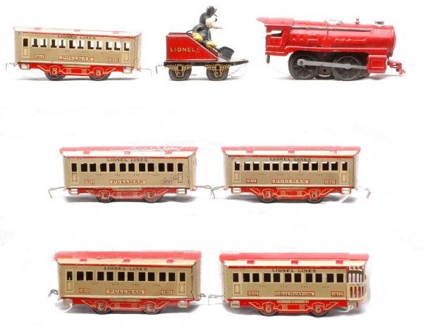 Lionel Mickey Mouse no.1514 1506 1509 4-1811 1812: Lionel prewar O gauge Mickey Mouse passenger set no. 1514, circa 1935 containing; 1506 red clockwork steam loco, 1509 Mickey Mouse stoker tender with a hard to find black frame and three 1811 Lionel L