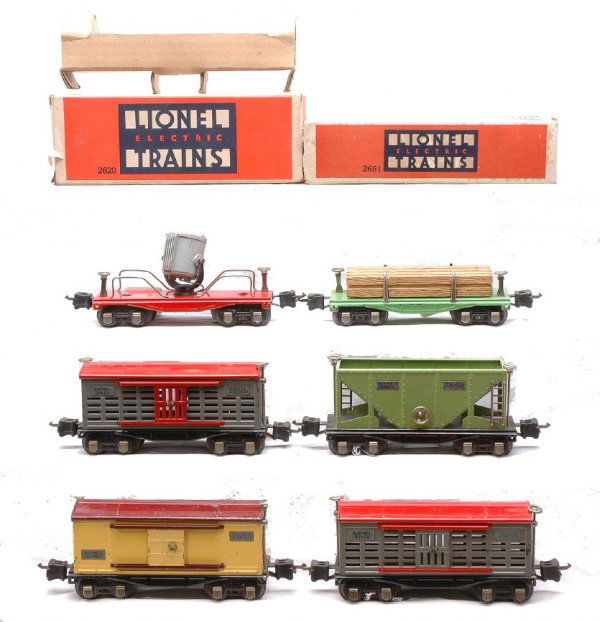 Lionel 2651 OB 2656 2656 2655 2620 OB 2653: Lionel prewar O gauge 2600 series freight cars; 2651 green lumber car in OB, 2656 cattle car with gray doors, 2656 cattle car with red doors, 2620 floodlight car in OB with original cardboard insert,