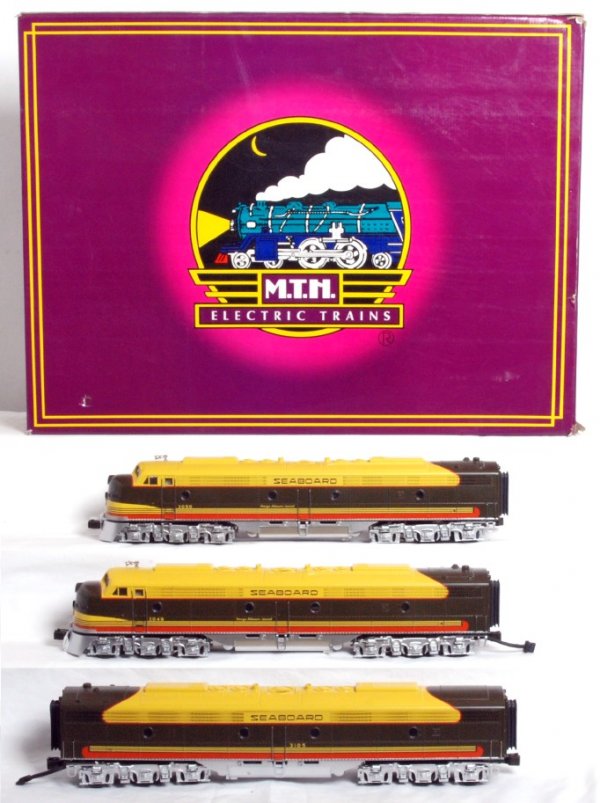 MTH No. 20-2168-1 Seaboard diesel A-B-A set in OB: MTH O gauge 3 rail No. 20-2168-1 Seaboard diesel EMD E-8 A-B-A set in original box, C8. Box shows light wear. Trains feature ProtoSmoke and ProtoSound.