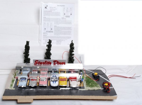 O gauge train layout Starlight Diner scene/diorama: Starlight Diner scene/diorama with six diecast autos and scenery. This was mounted and used on an operating and functional O gauge train layout. Wiring and control button present. This scene will need