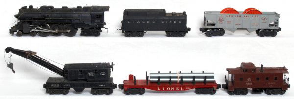 Lionel 646, 6026W, 6511, 6460, 6456, 6457: Lionel postwar O gauge 646 4-6-4 steam loco, 6026W tender with whistle, 6511 flatcar with pipe, 6460 operating work crane, 6456 Lehigh Valley hopper, 6457 caboose. Loco is missing marker light, crane