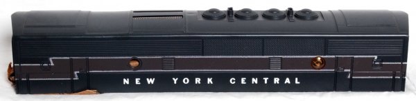 Mint NOS Lionel 2344C New York Central shell: Mint new old stock Lionel postwar O gauge 2344C New York Central B unit shell only, never mounted, bright graphics, screen top, C10. Includes the Lionel wrap that was stuff inside the cab. One porthol